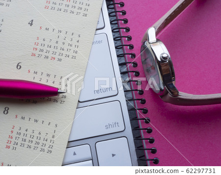 Business image · calendar · keyboard · notebook · woman 62297731
