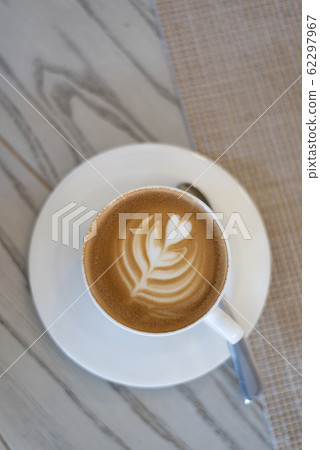 Fresh coffee latte with milk foam drawed heart 62297967