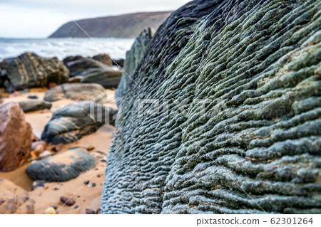 Kinnagoe bay in County Donegal, Inishowen has an extraordinary selection of colourful stones- Ireland Kinnagoe bay in County Donegal, Inishowen has an extraordinary selection of colourful stones- Ireland 62301264