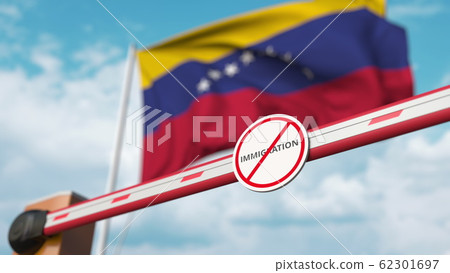 Closed boom barrier with stop immigration sign against the Venezuelan flag. Border closure or immigration ban in Venezuela. 3D rendering 62301697