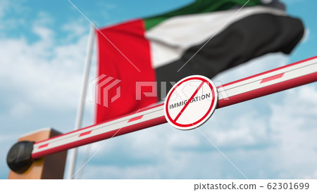 Closed boom barrier with stop immigration sign against the UAE flag. Restricted border crossing or immigration ban. 3D rendering 62301699