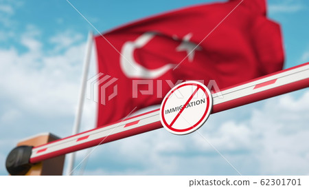 Closed boom gate with no immigration sign on the Turkish flag background. Restricted border crossing or immigration ban in Turkey. 3D rendering Closed boom gate with no immigration sign on the Turkish flag background. Restricted border crossing or immigration ban in Turkey. 3D rendering 62301701