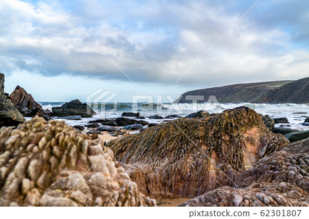 Kinnagoe bay in County Donegal, Inishowen has an extraordinary selection of colourful stones- Ireland Kinnagoe bay in County Donegal, Inishowen has an extraordinary selection of colourful stones- Ireland 62301807