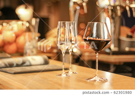 a glass of wine at the bar, alcoholic drink 62301980