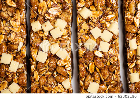 Protein granola bars with nutson a table Protein granola bars with nutson a table 62302186