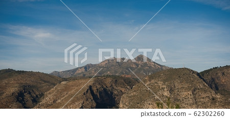 Autumn view of the mountain, brown and yellow slopes of the mountains in Africa with blue cloudy sky 62302260