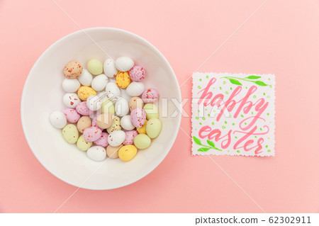 Inscription HAPPY EASTER letters candy chocolate 62302911