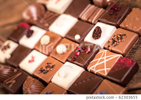 Assorted chocolate pralines on the wooden 62303655