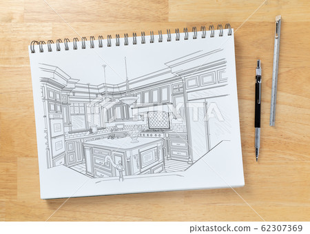 Sketch Pad on Desk Top with Drawing of Custom Kitchen Sketch Pad on Desk Top with Drawing of Custom Kitchen 62307369