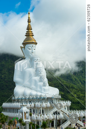 Five White Buddha statues sitting at Wat Pha Sorn Kaew Temple or Wat Phra Thart Pha Kaew Temple in Khao Kho Phetchabun Province Thailand. Five White Buddha statues sitting at Wat Pha Sorn Kaew Temple or Wat Phra Thart Pha Kaew Temple in Khao Kho Phetchabun Province Thailand. 62309726