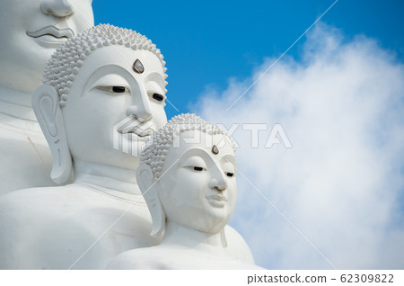 Face of White Buddha statues sit at Wat Pha Sorn Kaew Temple or Wat Phra Thart Pha Kaew Temple in Khao Kho Thailand. with blue sky 62309822