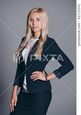 office concept, business plan, fashion-businesswoman in black and white suit working in office. Beautiful blonde woman in work 62310341