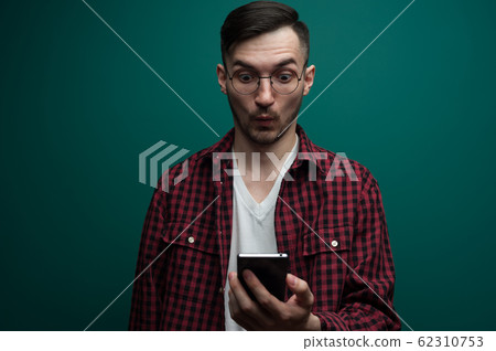 Portrait of an emotional surprised young hipster Portrait of an emotional surprised young hipster 62310753