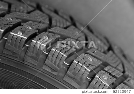 Fragment of a car studded tire Fragment of a car studded tire 62310947