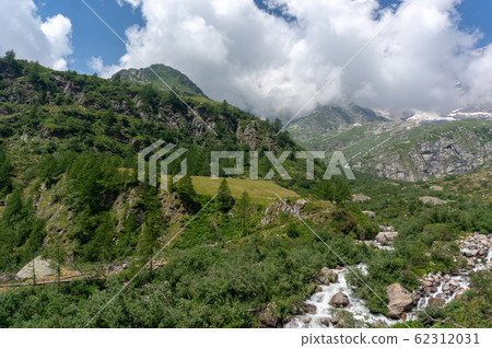 Trekking in Italian Alps mountain 62312031