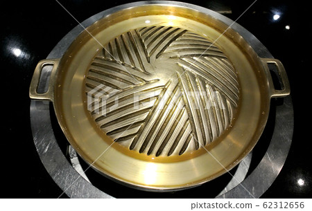 Brass hot pan for BBQ close up shot 62312656