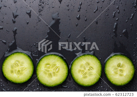 Isolated cucumber slices. Pieces of fresh cucumber Isolated cucumber slices. Pieces of fresh cucumber 62312723