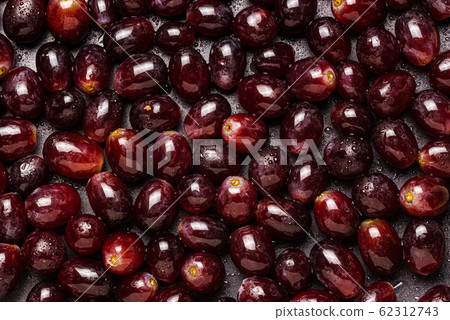 Background from red grapes covered with water Background from red grapes covered with water 62312743