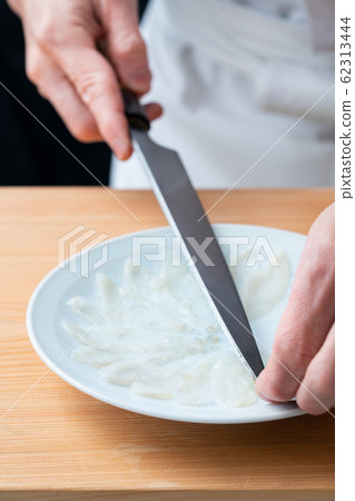 In front of the plate where the blowfish is made In front of the plate where the blowfish is made 62313444