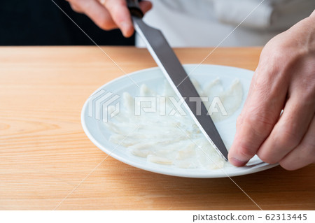 In front of the plate where the blowfish is made In front of the plate where the blowfish is made 62313445