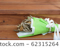 Withered roses on wood floor 62315264