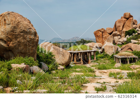 Ancient ruins in Hampi on sunset. India 62316314