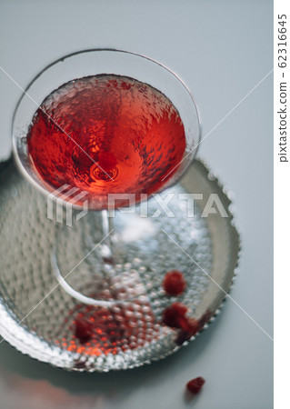 Classic red cocktail in crystal texture glass on white background 62316645