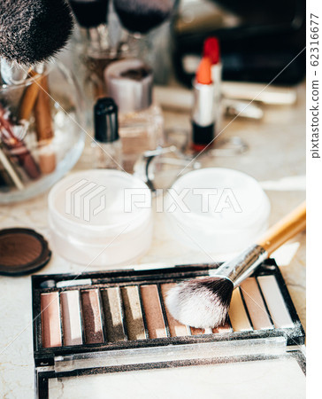Eyeshadow palette in beige colors with makeup brush Eyeshadow palette in beige colors with makeup brush 62316677