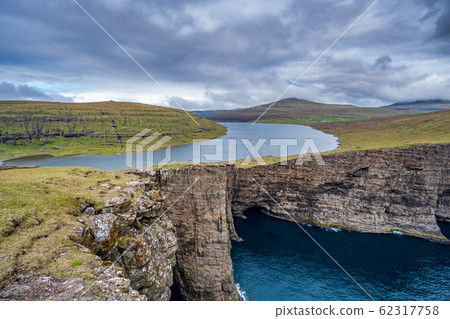 Sorvagsvatn lake cliffs over the ocean in Faroe Islands 62317758