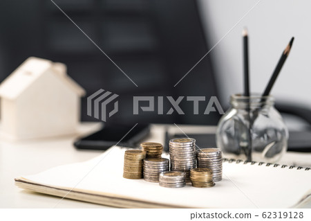Silver and gold coins stacked on the work Silver and gold coins stacked on the work 62319128
