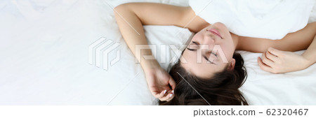 Young caucasian beauty woman sleeping on white bed Young caucasian beauty woman sleeping on white bed 62320467