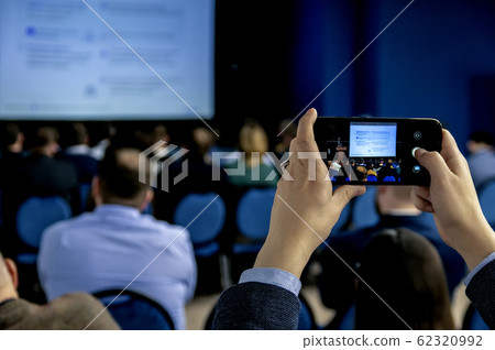 hands holding smartphone and taking pictures hands holding smartphone and taking pictures 62320992