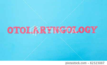 The word otolaryngology on a blue background. Concept is a section of medicine dealing with the treatment of the ear, throat and nose. ENT doctor The word otolaryngology on a blue background. Concept is a section of medicine dealing with the treatment of the ear, throat and nose. ENT doctor 62323887