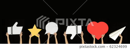 Hands holding the signs of social media on black studio background, flyer 62324699