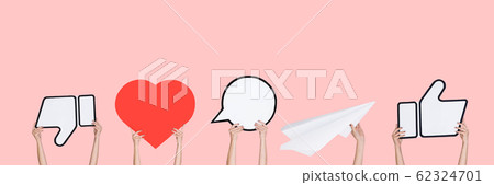 Hands holding the signs of social media on coral studio background, flyer Hands holding the signs of social media on coral studio background, flyer 62324701