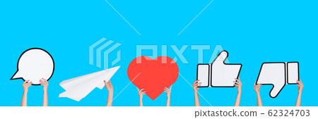 Hands holding the signs of social media on blue studio background, flyer Hands holding the signs of social media on blue studio background, flyer 62324703