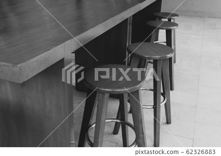 wooden chairs in coffee shop - black and white tone. wooden chairs in coffee shop - black and white tone. 62326883