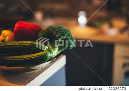 Fresh vegetables on table in modern kitchen. Fresh vegetables on table in modern kitchen. 62326970