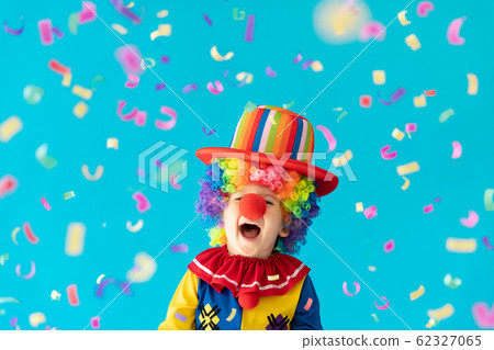 Funny kid clown playing indoor 62327065