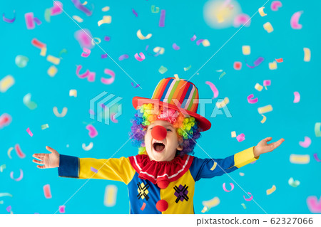Funny kid clown playing indoor 62327066