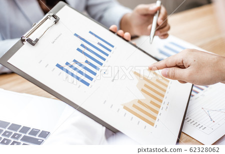 Meeting a team of businessmen, Executives and accountants meeting about the company's revenue graph in the office with laptops and calculators, Finance concept 62328062