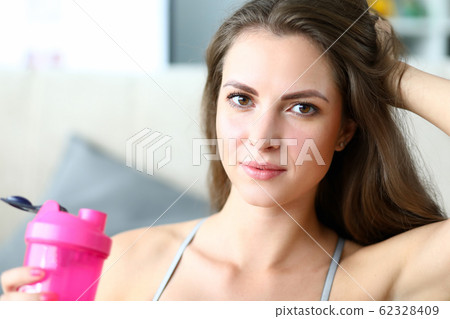 Beautiful girl holds sports water bottle, training Beautiful girl holds sports water bottle, training 62328409