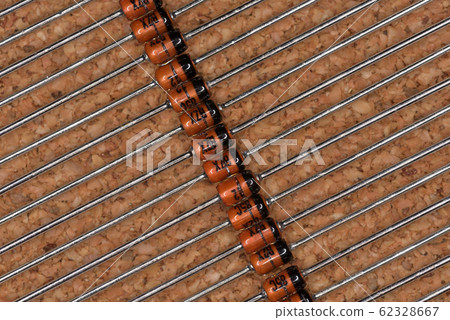 Electronic components, glass molded zener diode (cork background) Electronic components, glass molded zener diode (cork background) 62328667