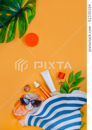 Sanscreen. Beach set: hat, sun glasses and protection cream SPF Beach accessories. Summer Travel Vacation Concept Sanscreen. Beach set: hat, sun glasses and protection cream SPF Beach accessories. Summer Travel Vacation Concept 62330104