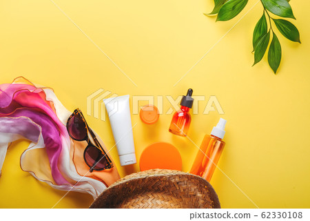 Sanscreen. Beach set: hat, sun glasses and protection cream SPF Beach accessories. Summer Travel Vacation Concept Sanscreen. Beach set: hat, sun glasses and protection cream SPF Beach accessories. Summer Travel Vacation Concept 62330108
