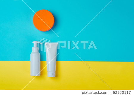 Sunprotection products, sanscreen. Minimal concept of summer vacation, tanning. Natural cosmetics, cream with SPF 62330117