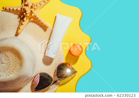 Sunscreen. Straw hat with sun glasses, protection cream SPF Beach accessories. Summer Travel Concept Sunscreen. Straw hat with sun glasses, protection cream SPF Beach accessories. Summer Travel Concept 62330123