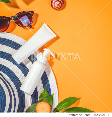 Sunprotection objects. Hat with sunglasses and protection cream SPF Beach accessories. Summer Travel Vacation Concept Sunprotection objects. Hat with sunglasses and protection cream SPF Beach accessories. Summer Travel Vacation Concept 62330127