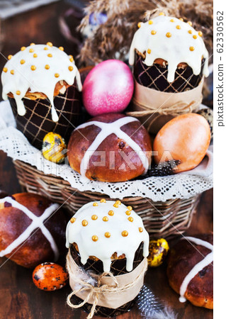 Holiday Easter cakes, hot cross buns and colorful Holiday Easter cakes, hot cross buns and colorful 62330562