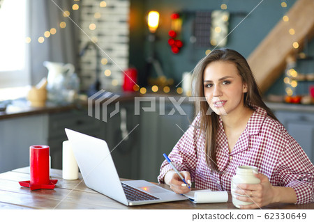 Female freelancer making notes at home Female freelancer making notes at home 62330649